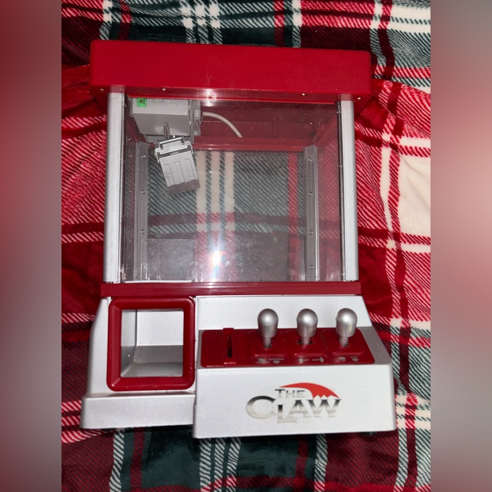 Vintage Red and Silver The Claw Machine
